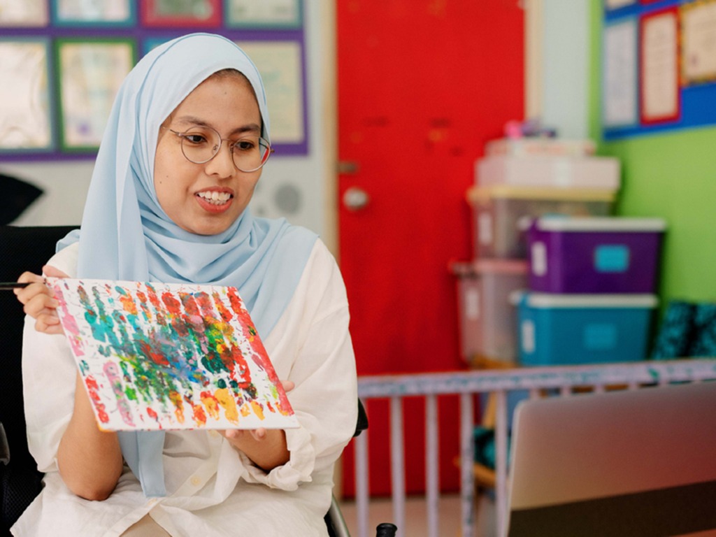 Teacher showing drawing